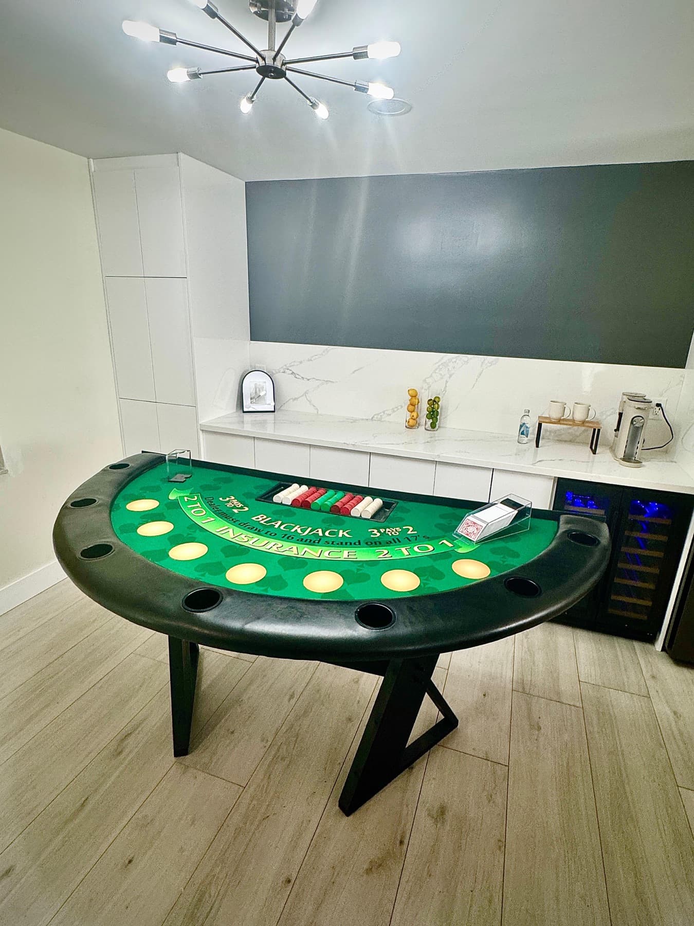 Green blackjack table with an LED rim set up in a modern home