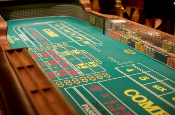 Craps table layout with the pass line and come areas