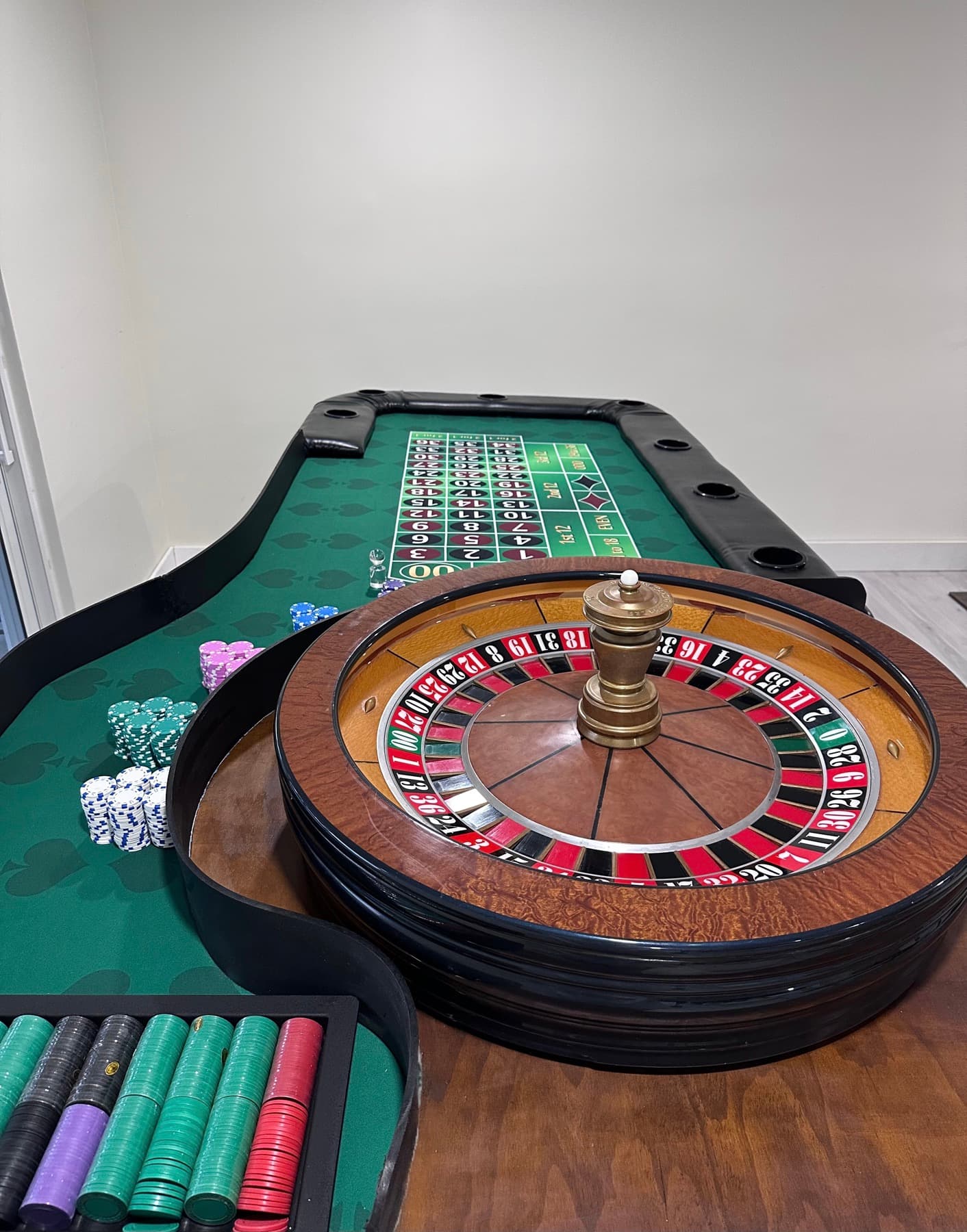 Roulette table and wheel seen from the side